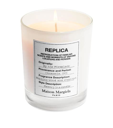 replica' by the fireplace candle.